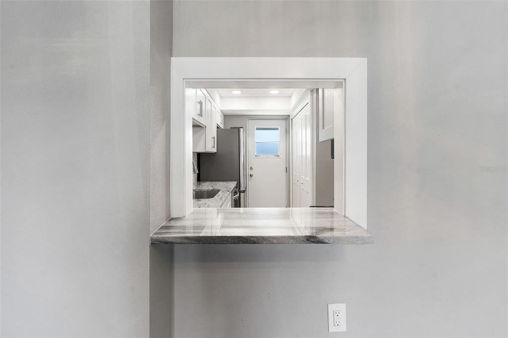 1 Boca Ciega Point Boulevard, Unit 113 St. Petersburg, FL 33708 - Photo 6 of 36 a bathroom with a sink and a mirror