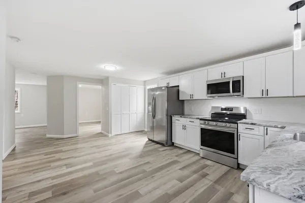a view of a livingroom with wooden floor