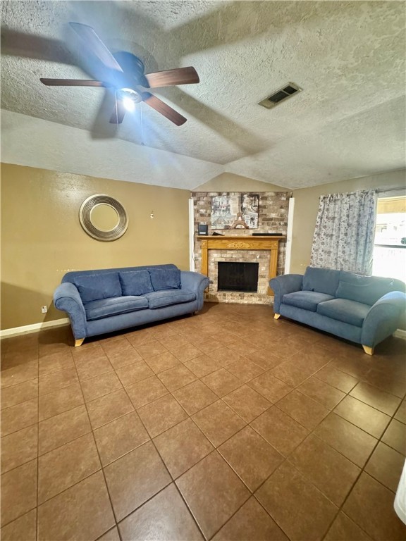 2408 North Thompson Street Conroe, TX 77303 - Photo 3 of 5 a living room with couches and a fireplace with wooden floor