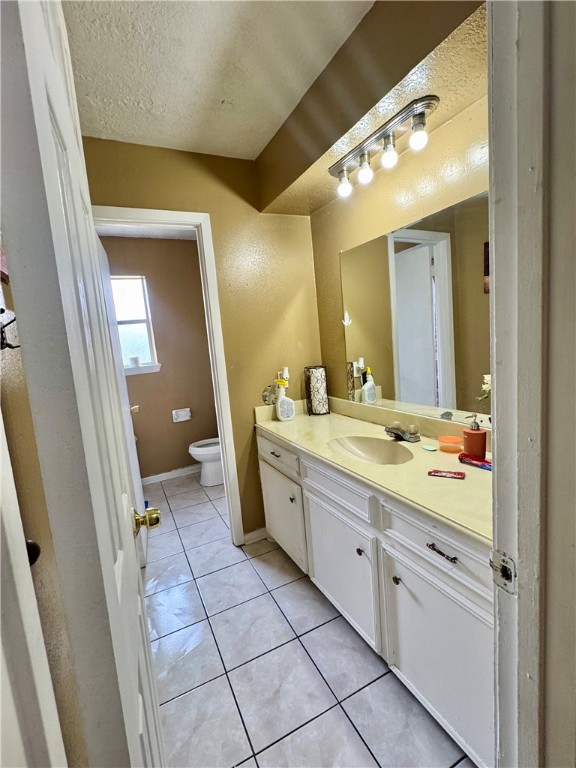 2408 North Thompson Street Conroe, TX 77303 - Photo 4 of 5 a spacious bathroom with a granite countertop sink mirror and a