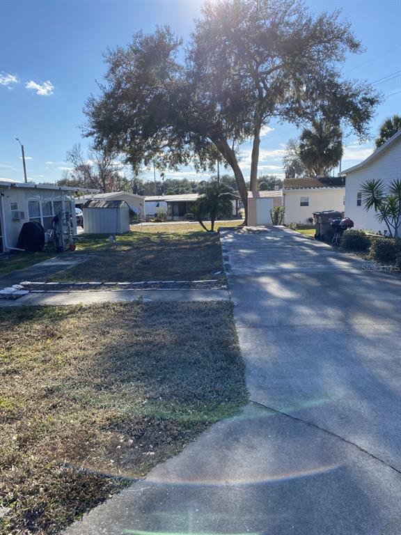542 Lock Road Leesburg, FL 34788 - Photo 1 of 1 a view of street with trees