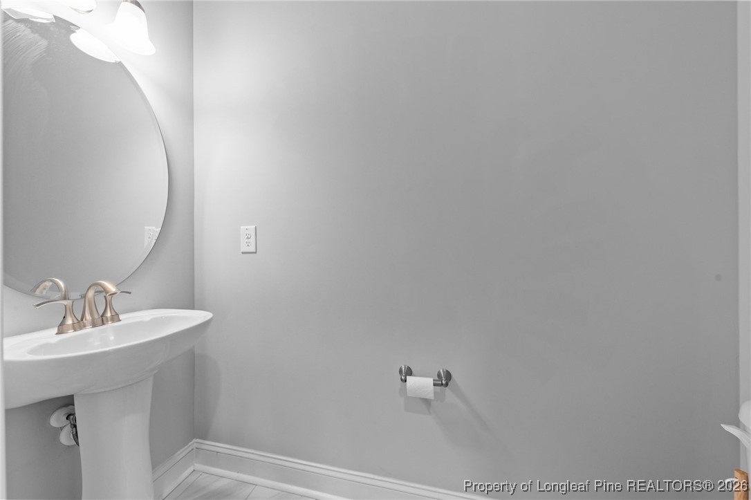 298 Turkey Trot Lane Raeford, NC 28376 - Photo 14 of 43 a bathroom with a sink and mirror