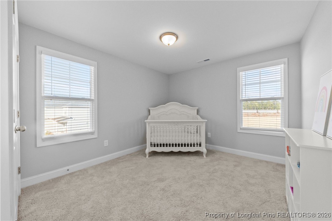 298 Turkey Trot Lane Raeford, NC 28376 - Photo 19 of 43 a room with a window and a dresser