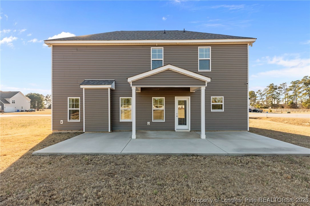 298 Turkey Trot Lane Raeford, NC 28376 - Photo 2 of 43 a front view of a house with a yard and garage