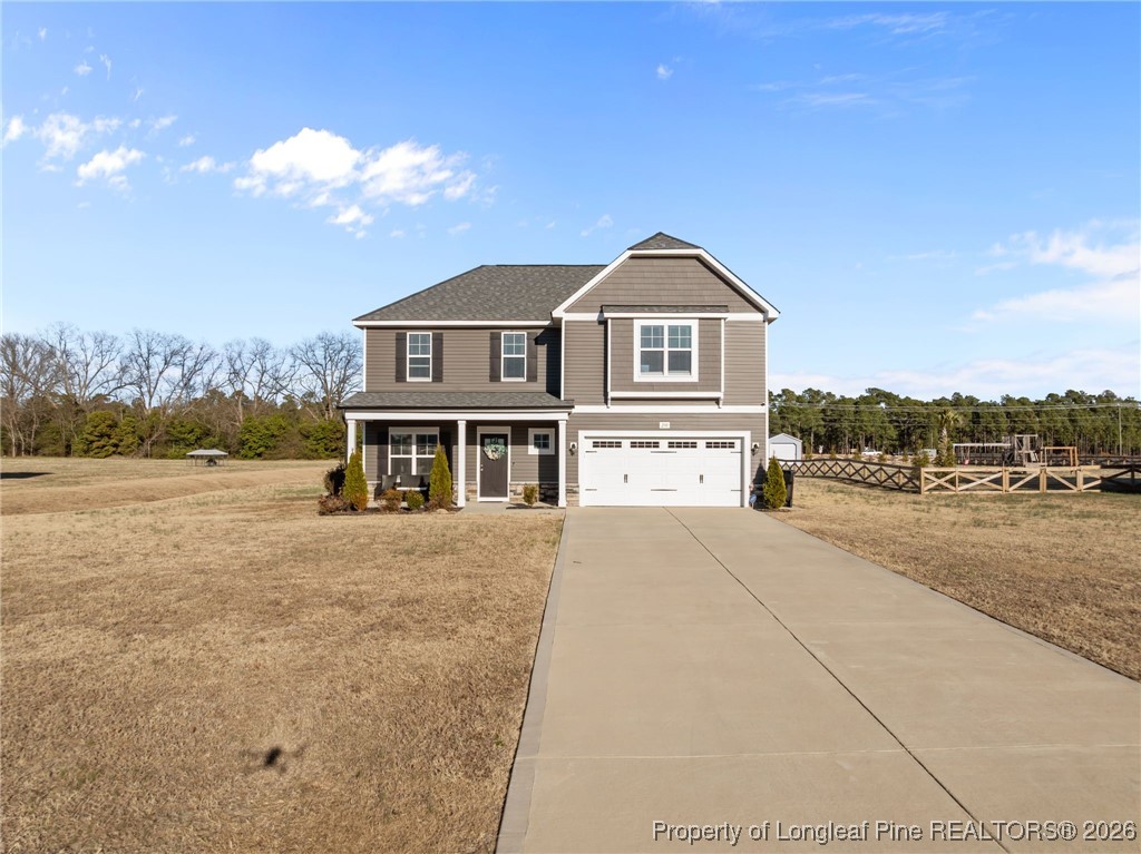 298 Turkey Trot Lane Raeford, NC 28376 - Photo 34 of 43 a front view of a house with a yard