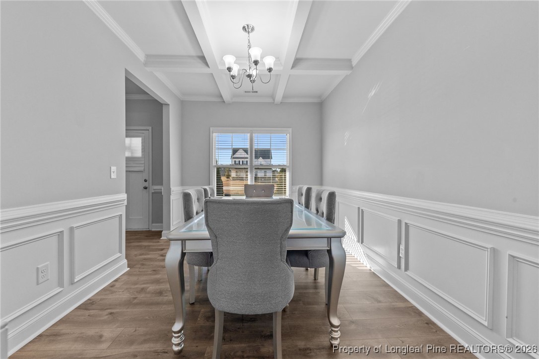 298 Turkey Trot Lane Raeford, NC 28376 - Photo 4 of 43 a view of a dining room with furniture and wooden floor