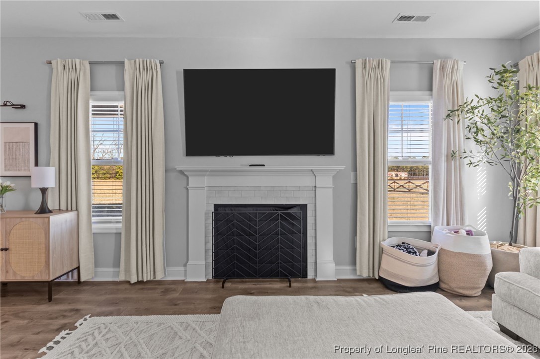 298 Turkey Trot Lane Raeford, NC 28376 - Photo 8 of 43 a living room with furniture and a fireplace