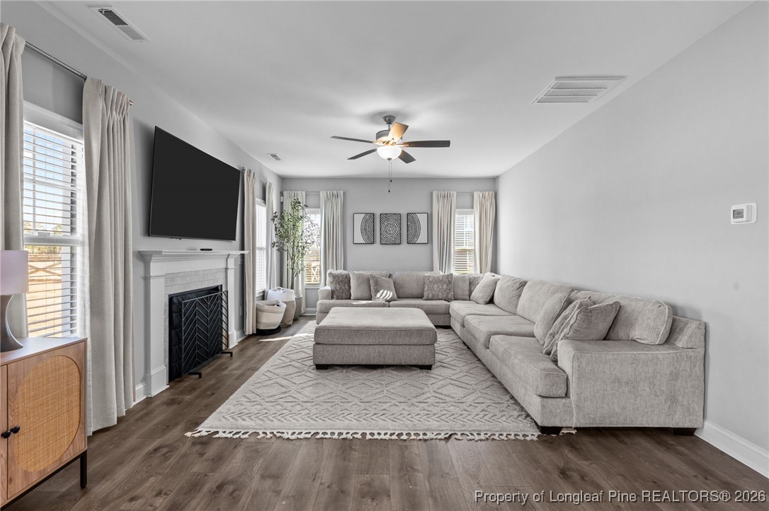298 Turkey Trot Lane Raeford, NC 28376 - Photo 9 of 43 a living room with furniture a fireplace and a flat screen tv