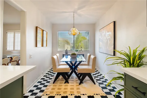 a dining room with furniture and window