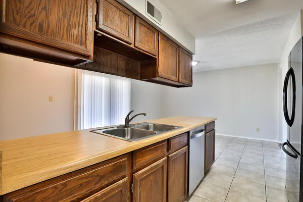 a kitchen with a sink and cabinets