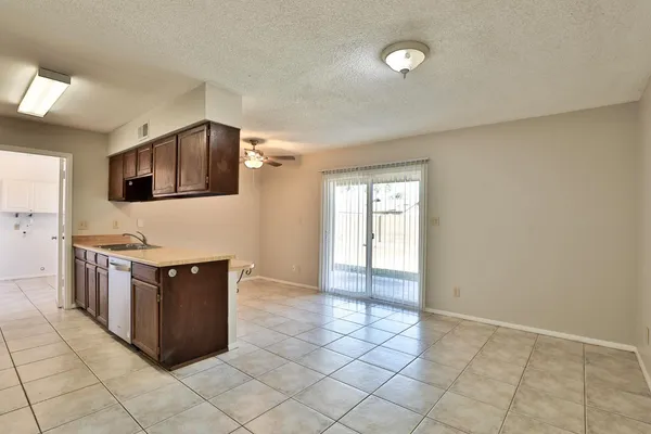 a kitchen with stainless steel appliances a stove a microwave and cabinets