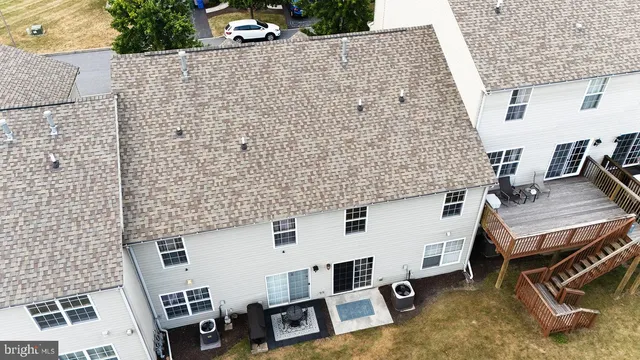 aerial view of a house with swimming pool and sitting area