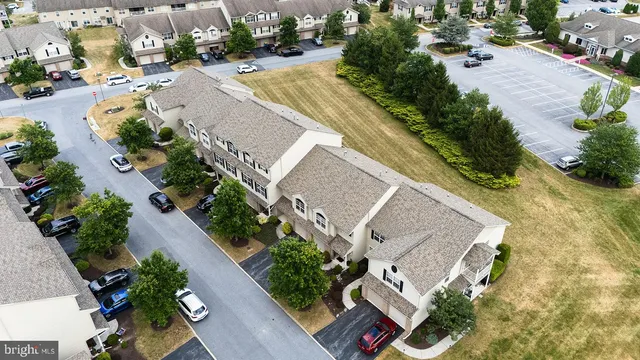 an aerial view of a house with swimming pool