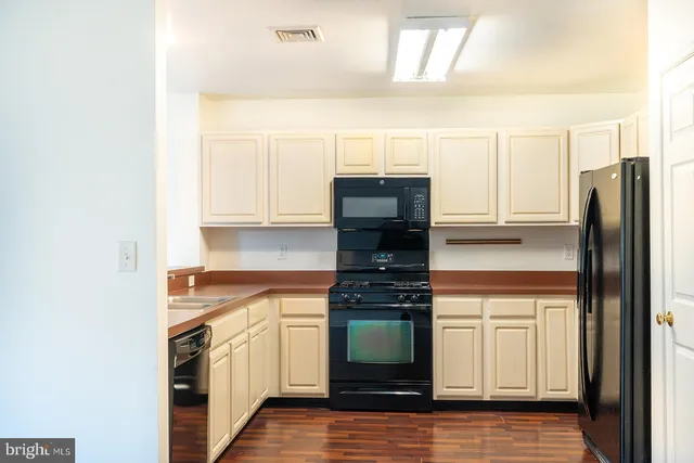 a kitchen with a stove and a refrigerator