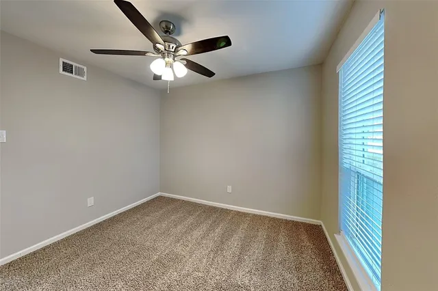 wooden floor in an empty room and a window