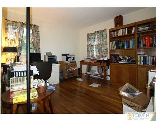 7 Cleveland Road Princeton, NJ 08540 - Photo 15 of 24 a living room with furniture a bookshelf and a window