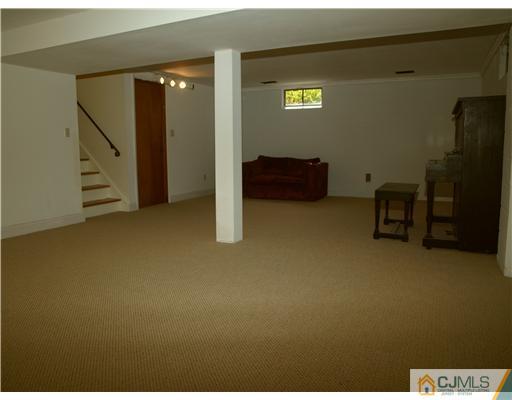 7 Cleveland Road Princeton, NJ 08540 - Photo 17 of 24 a view of an empty room with wooden floor and closet