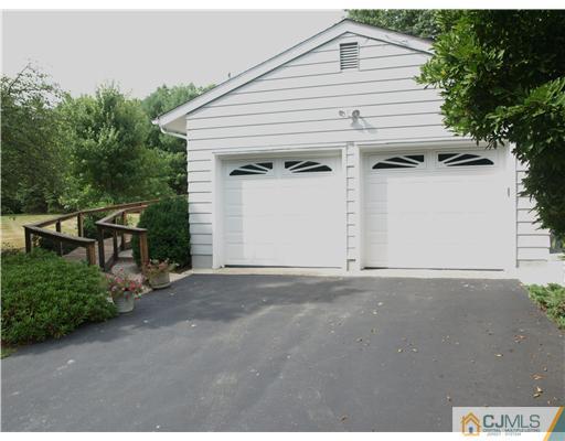 7 Cleveland Road Princeton, NJ 08540 - Photo 19 of 24 a view of a white house with a road and garage