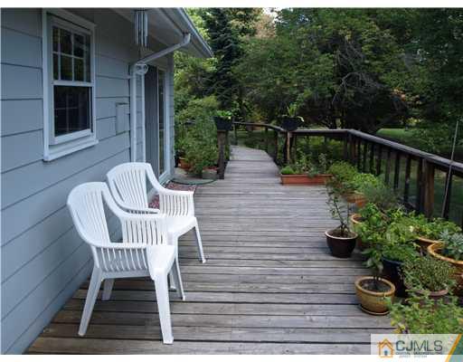 7 Cleveland Road Princeton, NJ 08540 - Photo 22 of 24 a view of a chair and tables back yard of the house