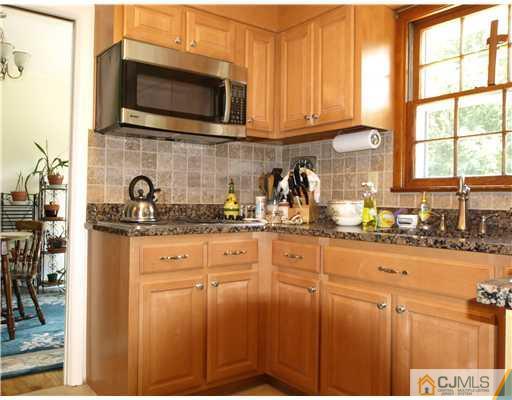 7 Cleveland Road Princeton, NJ 08540 - Photo 9 of 24 a kitchen with stainless steel appliances granite countertop a sink a stove and cabinets