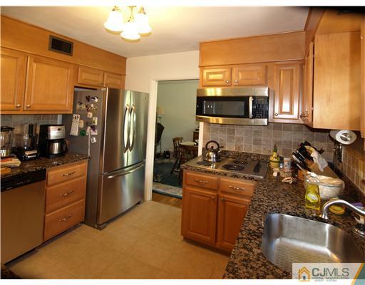 7 Cleveland Road Princeton, NJ 08540 - Photo 10 of 24 a kitchen with a refrigerator sink and microwave