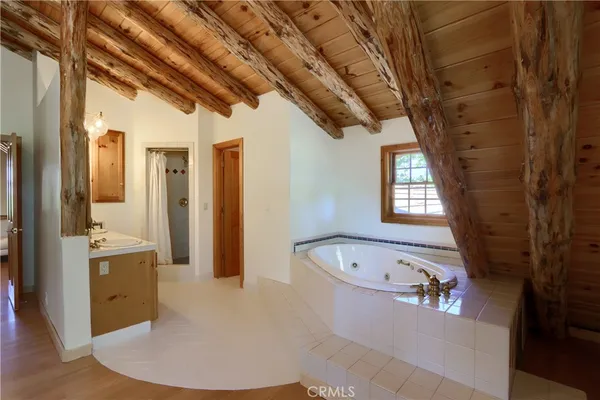 a bedroom with a large bed and a large window