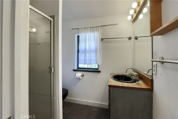 a view of a lush green outdoor space with a lake view and mountain view