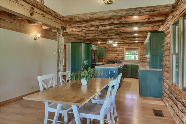 a kitchen with a sink window and cabinets