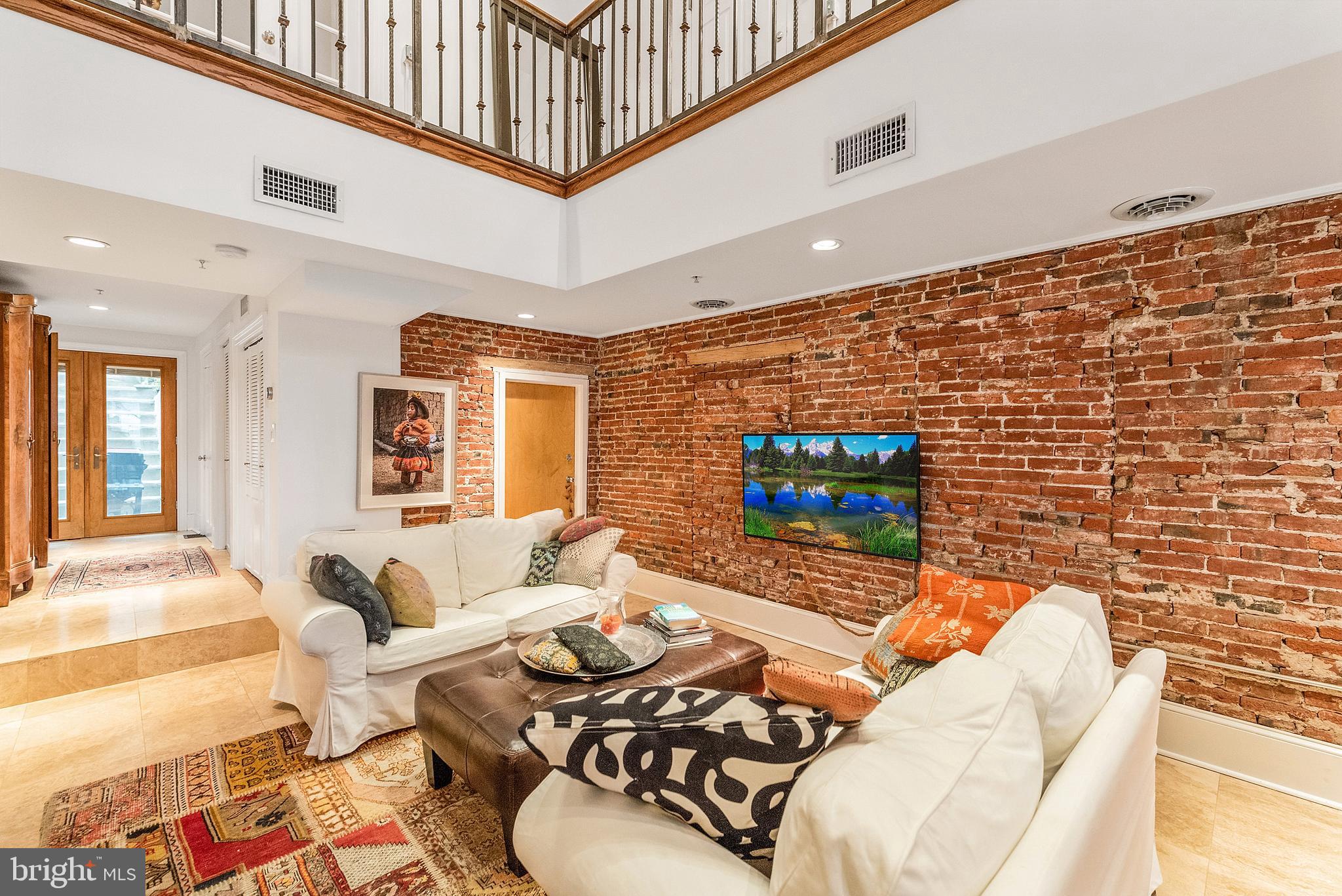 608 South 9th Street, Unit 1 Philadelphia, PA 19147 - Photo 2 of 23 a living room with furniture and a flat screen tv