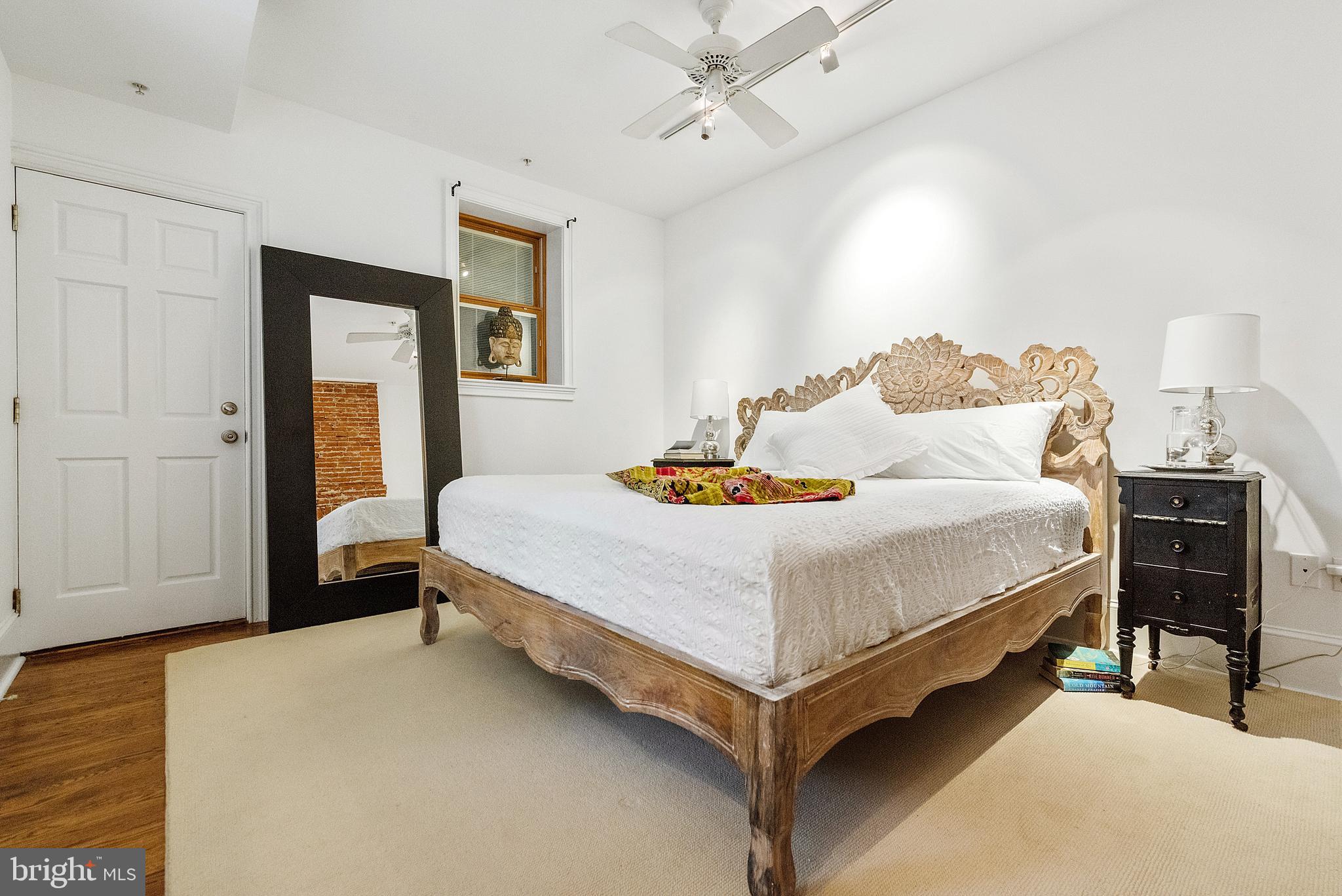 608 South 9th Street, Unit 1 Philadelphia, PA 19147 - Photo 13 of 23 a bedroom with a bed and wooden floor