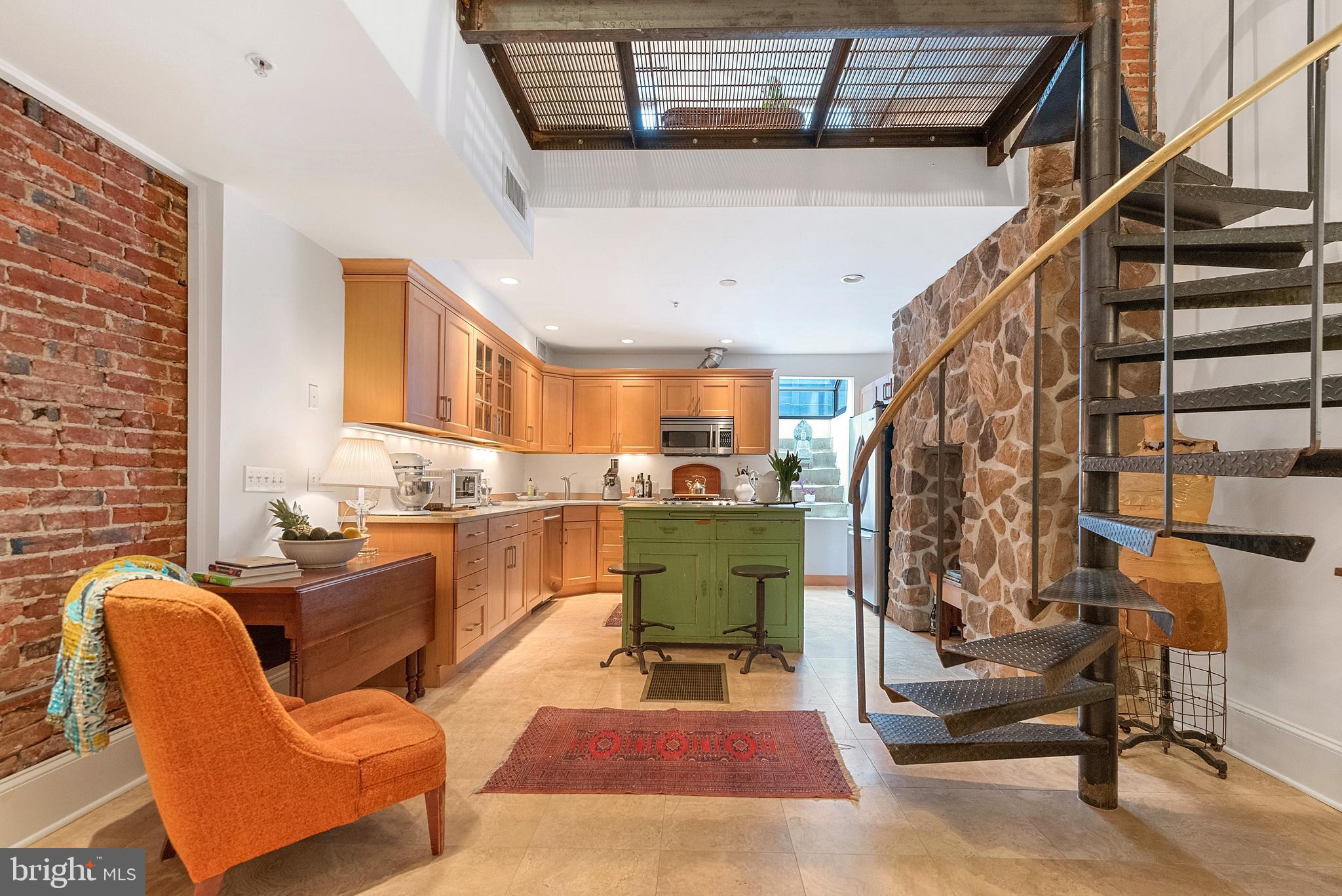 608 South 9th Street, Unit 1 Philadelphia, PA 19147 - Photo 7 of 23 a living room with furniture a rug and white walls