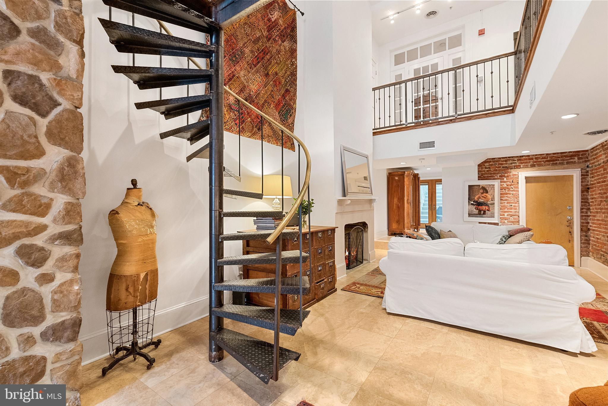 608 South 9th Street, Unit 1 Philadelphia, PA 19147 - Photo 9 of 23 a living room with furniture a rug and white walls