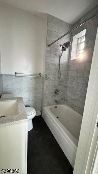 113 Broadway, Unit 1 Newark, NJ 07104 - Photo 8 of 8 a bathroom with a sink a toilet and shower