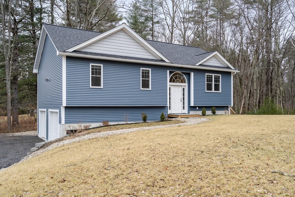 143 North Brookfield Road Barre, MA 01005 - Photo 1 of 31 a house with trees in the background