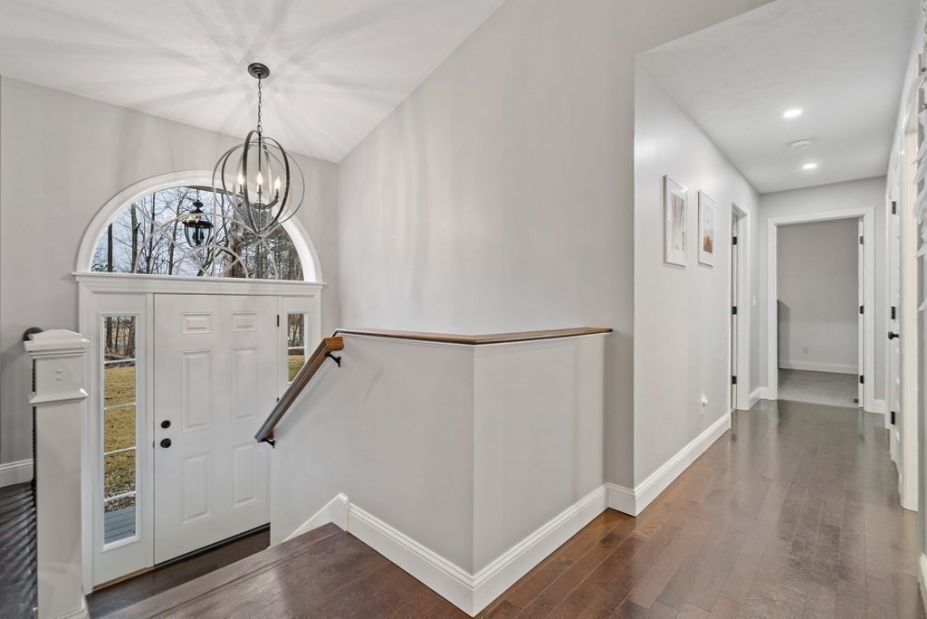 143 North Brookfield Road Barre, MA 01005 - Photo 21 of 31 a view of a hallway to a room with wooden floor and windows