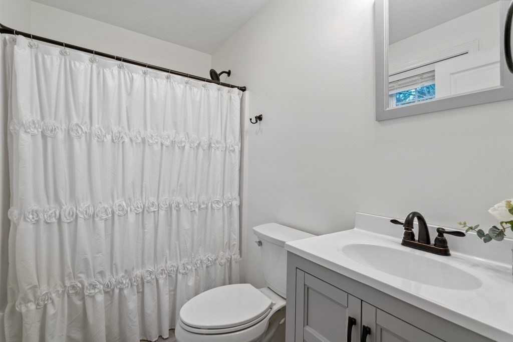 143 North Brookfield Road Barre, MA 01005 - Photo 24 of 31 a bathroom with a sink a toilet and shower curtain