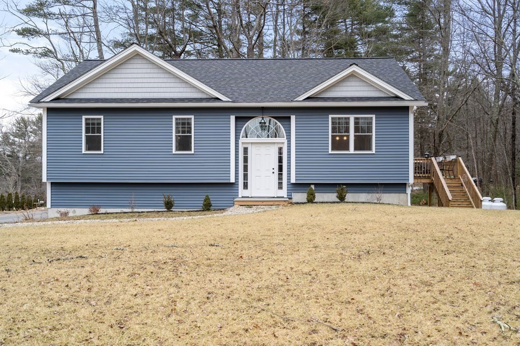 143 North Brookfield Road Barre, MA 01005 - Photo 4 of 31 a front view of a house with a yard and garage