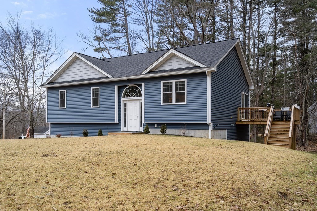 143 North Brookfield Road Barre, MA 01005 - Photo 5 of 31 a front view of a house with a yard covered in snow