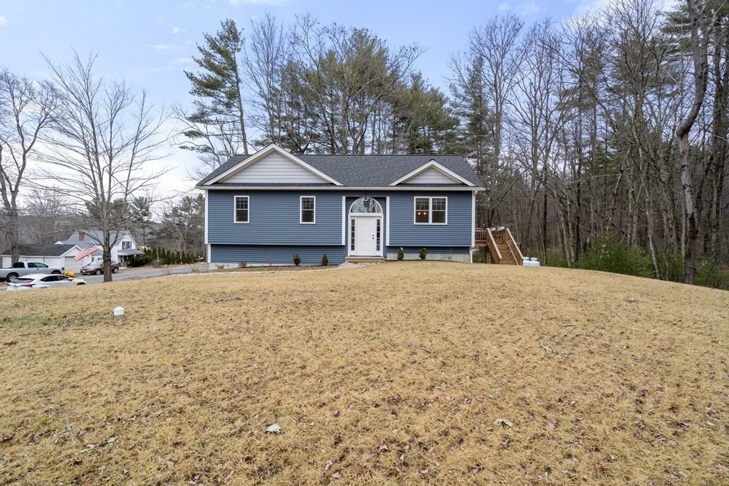 143 North Brookfield Road Barre, MA 01005 - Photo 6 of 31 a front view of a house with a yard covered in snow