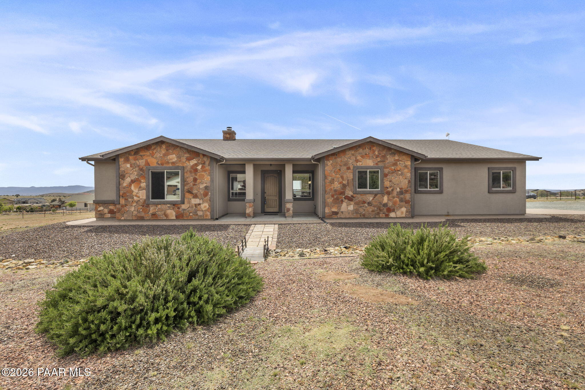 14141 Cassidy Trail Prescott Valley, AZ 86315 - Photo 1 of 44 a front view of a house with garden