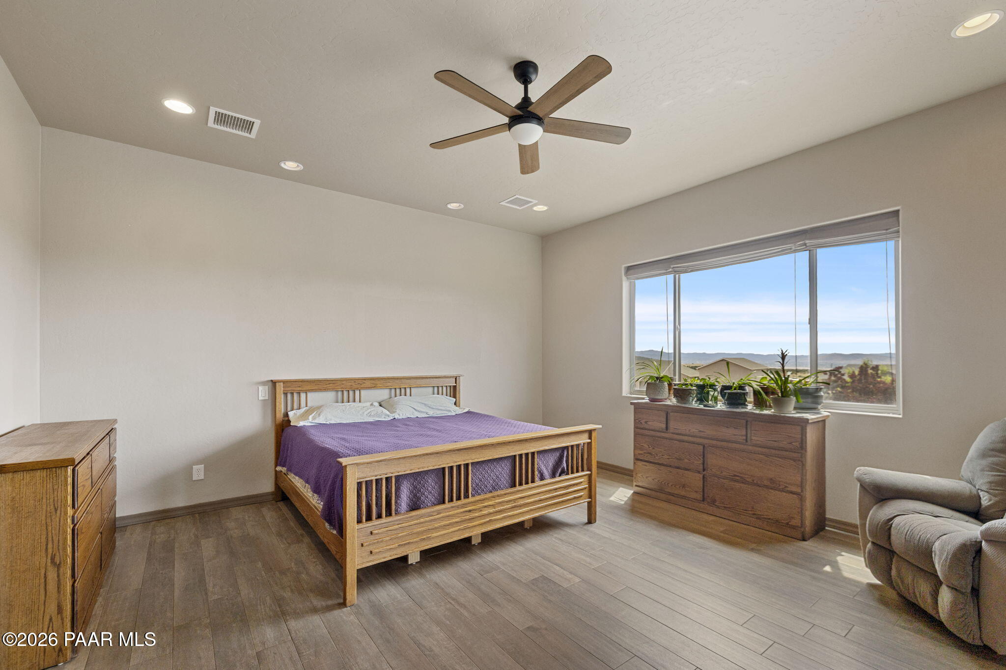 14141 Cassidy Trail Prescott Valley, AZ 86315 - Photo 15 of 44 a bedroom with a bed and window