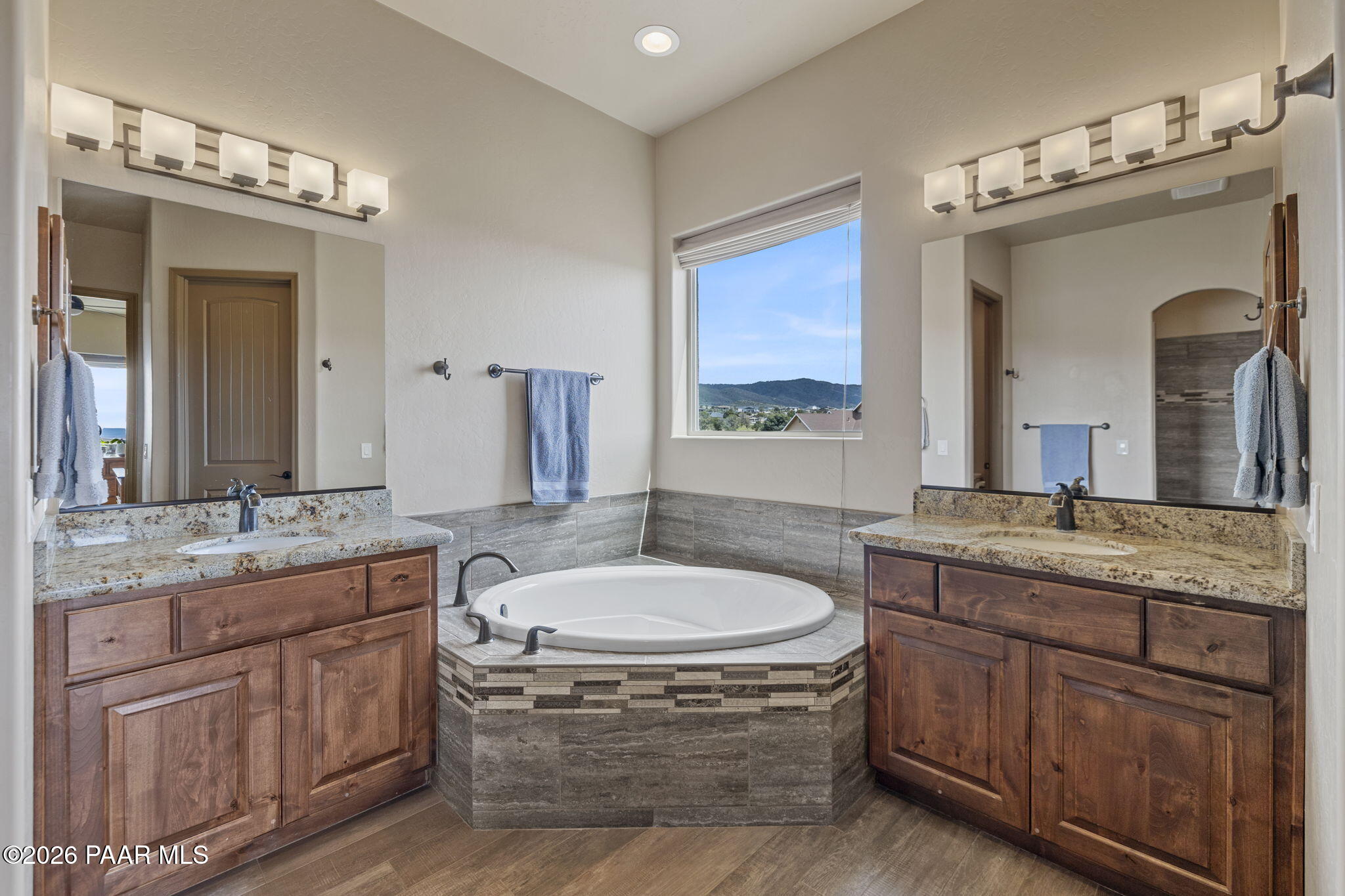 14141 Cassidy Trail Prescott Valley, AZ 86315 - Photo 18 of 44 a bathroom with a granite countertop sink and a mirror