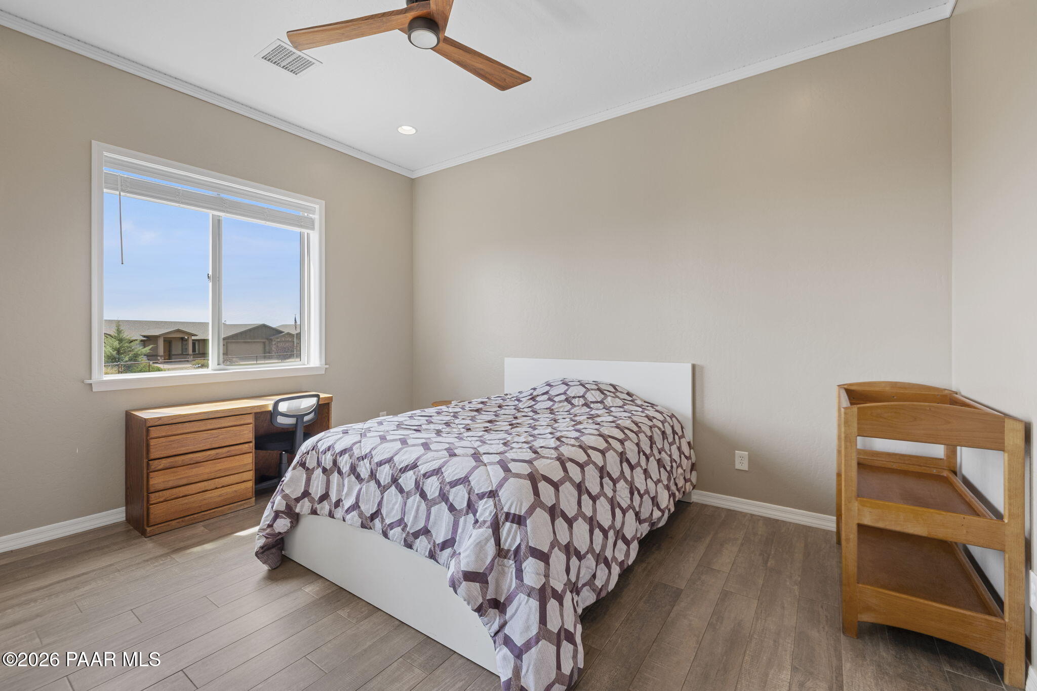 14141 Cassidy Trail Prescott Valley, AZ 86315 - Photo 21 of 44 a bedroom with a bed and a window