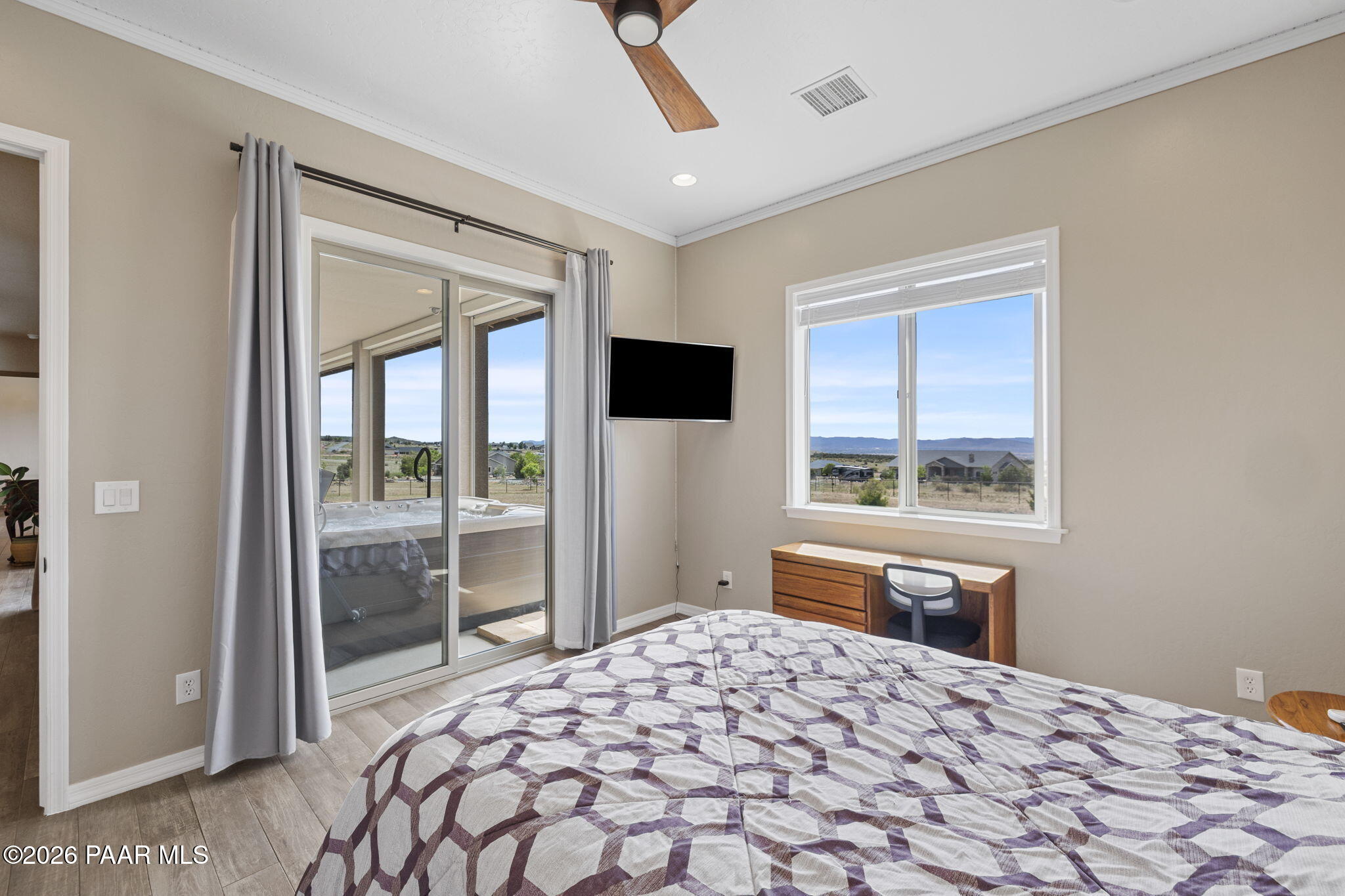 14141 Cassidy Trail Prescott Valley, AZ 86315 - Photo 22 of 44 a bedroom with a bed and a window