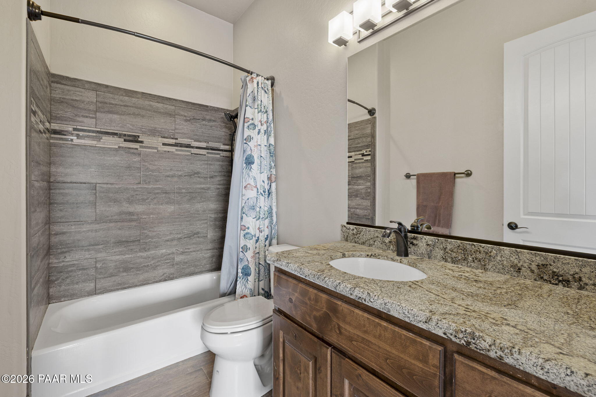 14141 Cassidy Trail Prescott Valley, AZ 86315 - Photo 23 of 44 a bathroom with a granite countertop sink toilet and shower