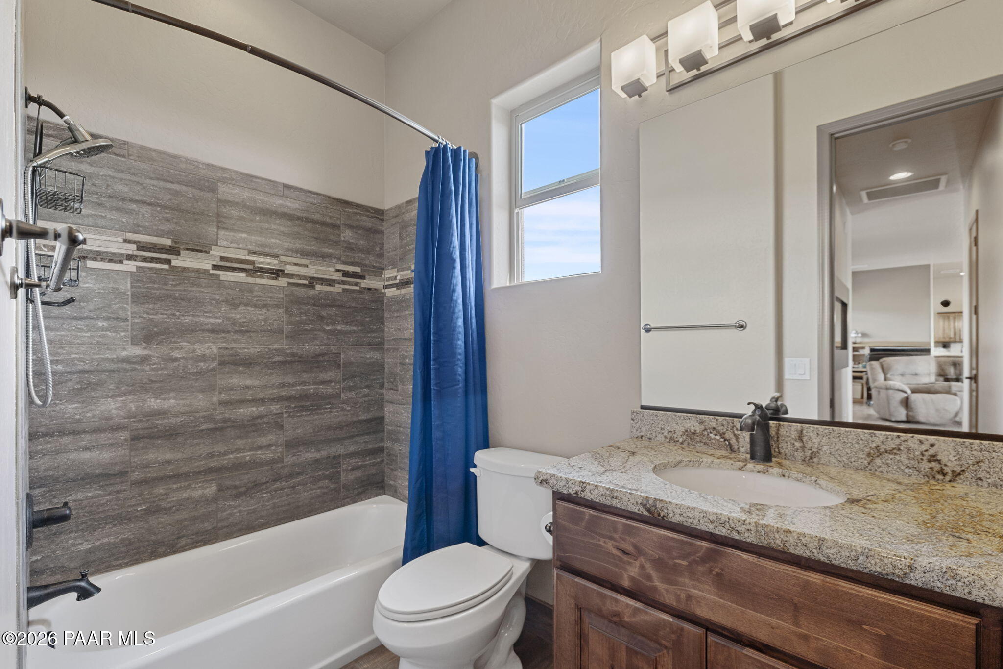 14141 Cassidy Trail Prescott Valley, AZ 86315 - Photo 26 of 44 a bathroom with a granite countertop sink toilet and shower