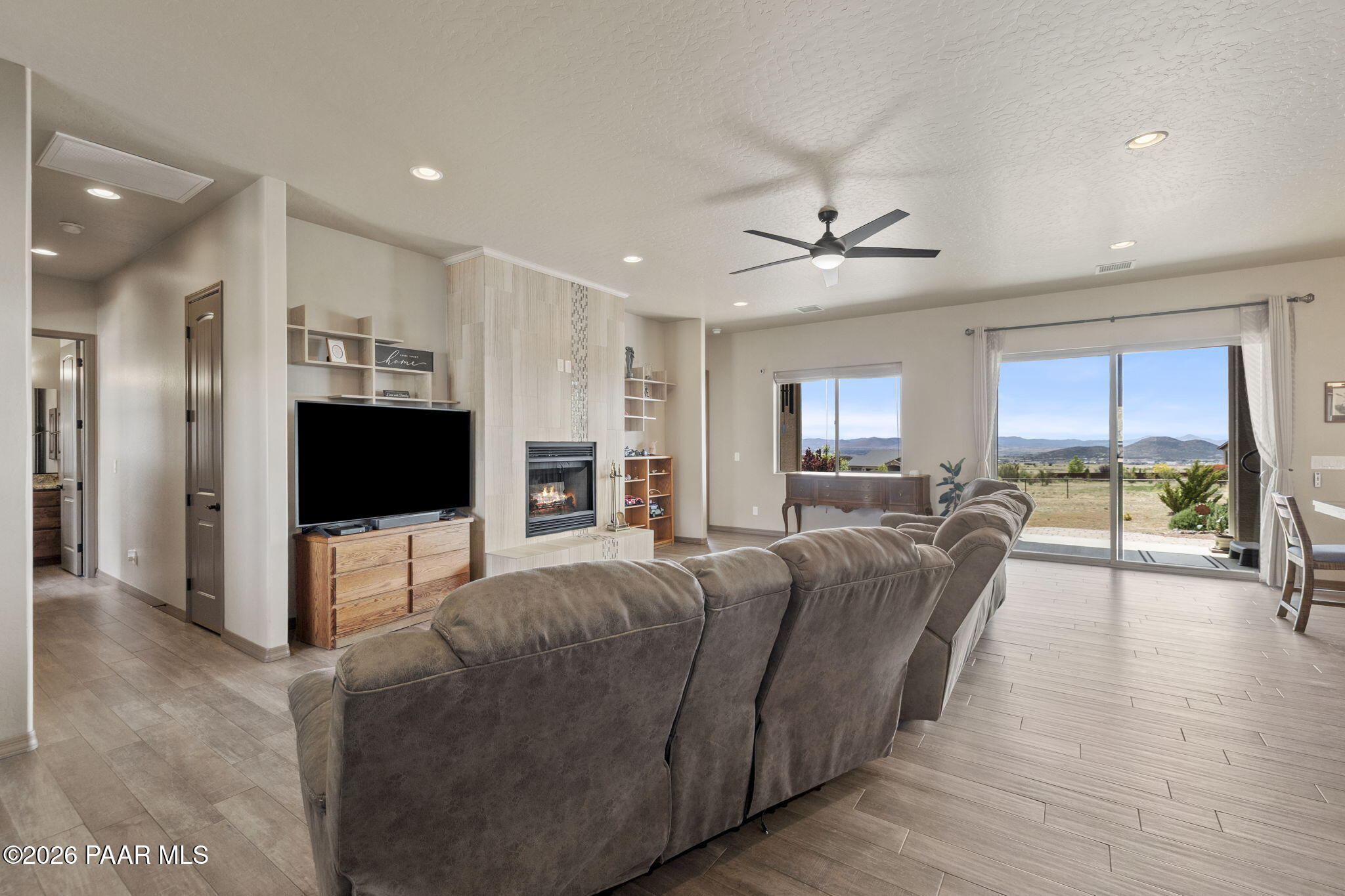 14141 Cassidy Trail Prescott Valley, AZ 86315 - Photo 6 of 44 a living room with furniture and a flat screen tv