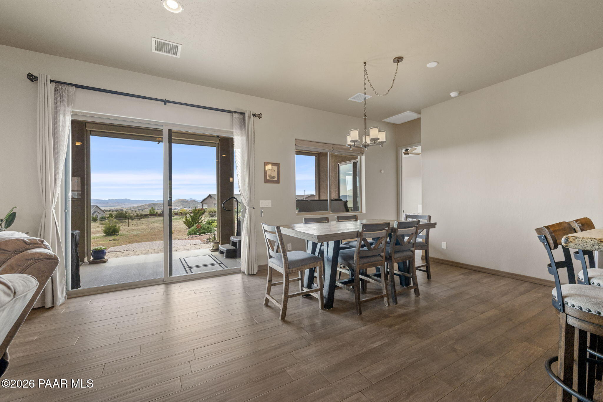 14141 Cassidy Trail Prescott Valley, AZ 86315 - Photo 8 of 44 a view of a dining room with furniture window and outside view