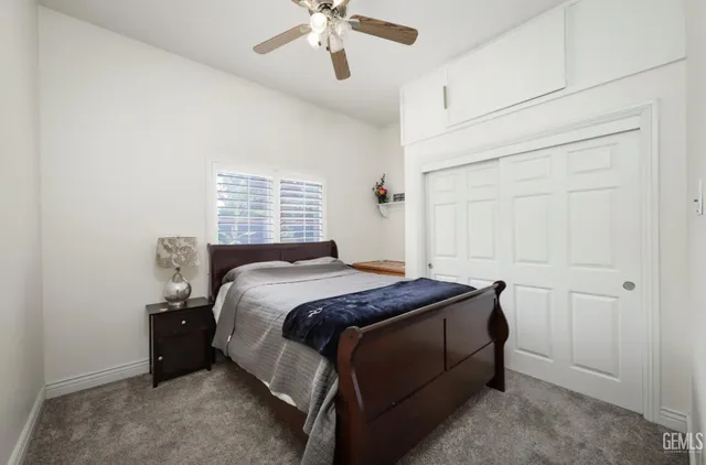 a bathroom with a toilet a sink and a mirror