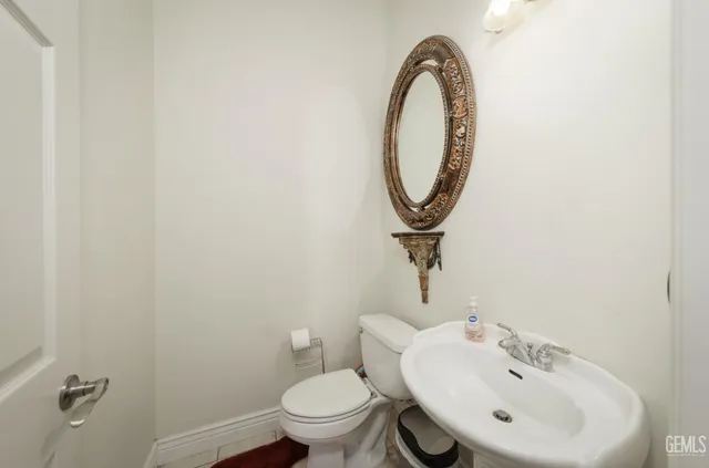 a view of a porch with a floor to ceiling window and palm tree